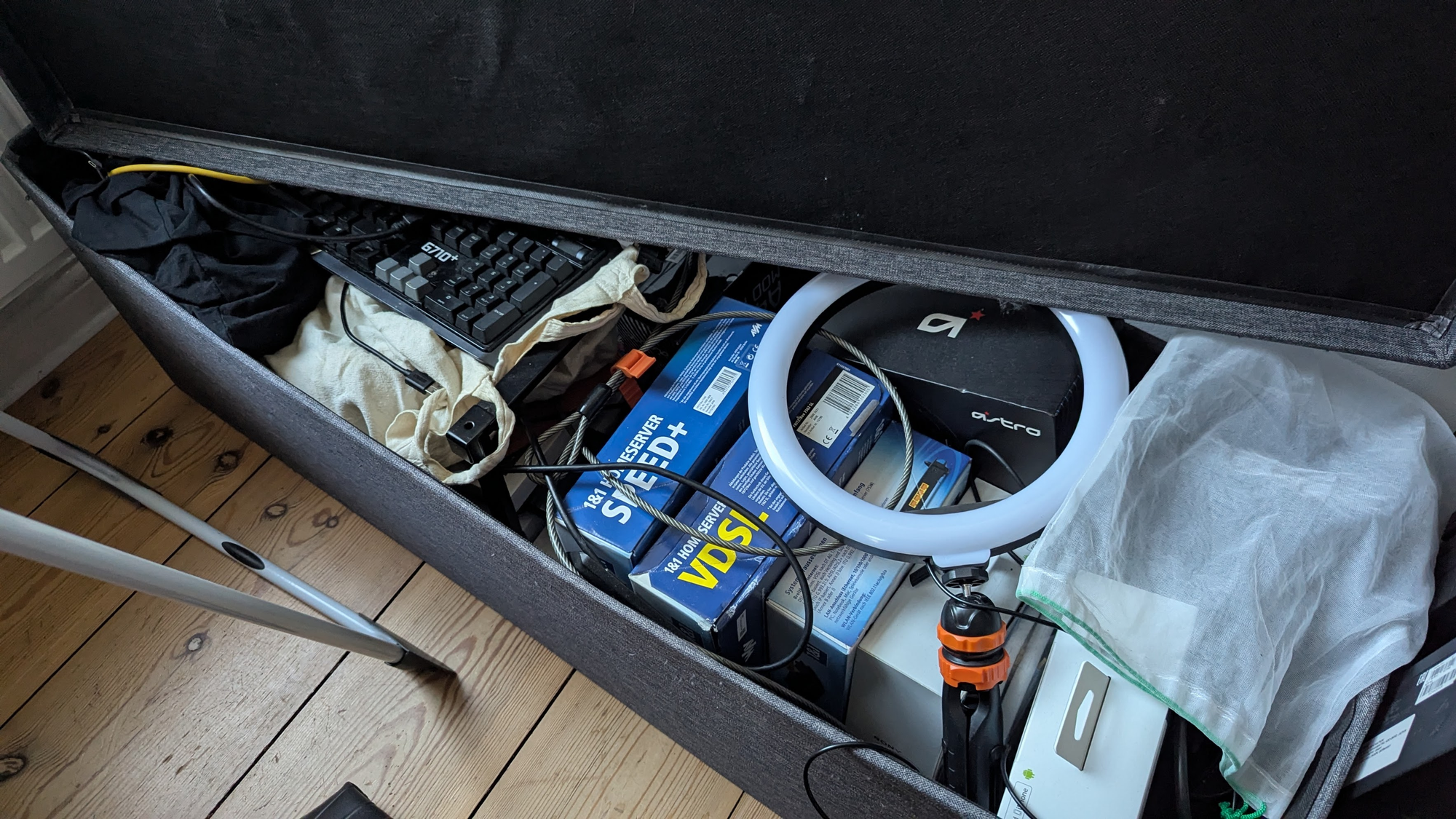 A large trunk with components, bags of cables, highly unordered, never catalogued and hard to search through